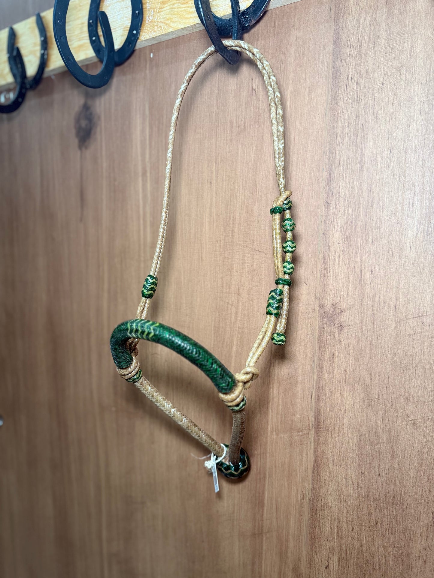 5/8” rawhide braided bosal with natural accents & matching rawhide hanger with black knots