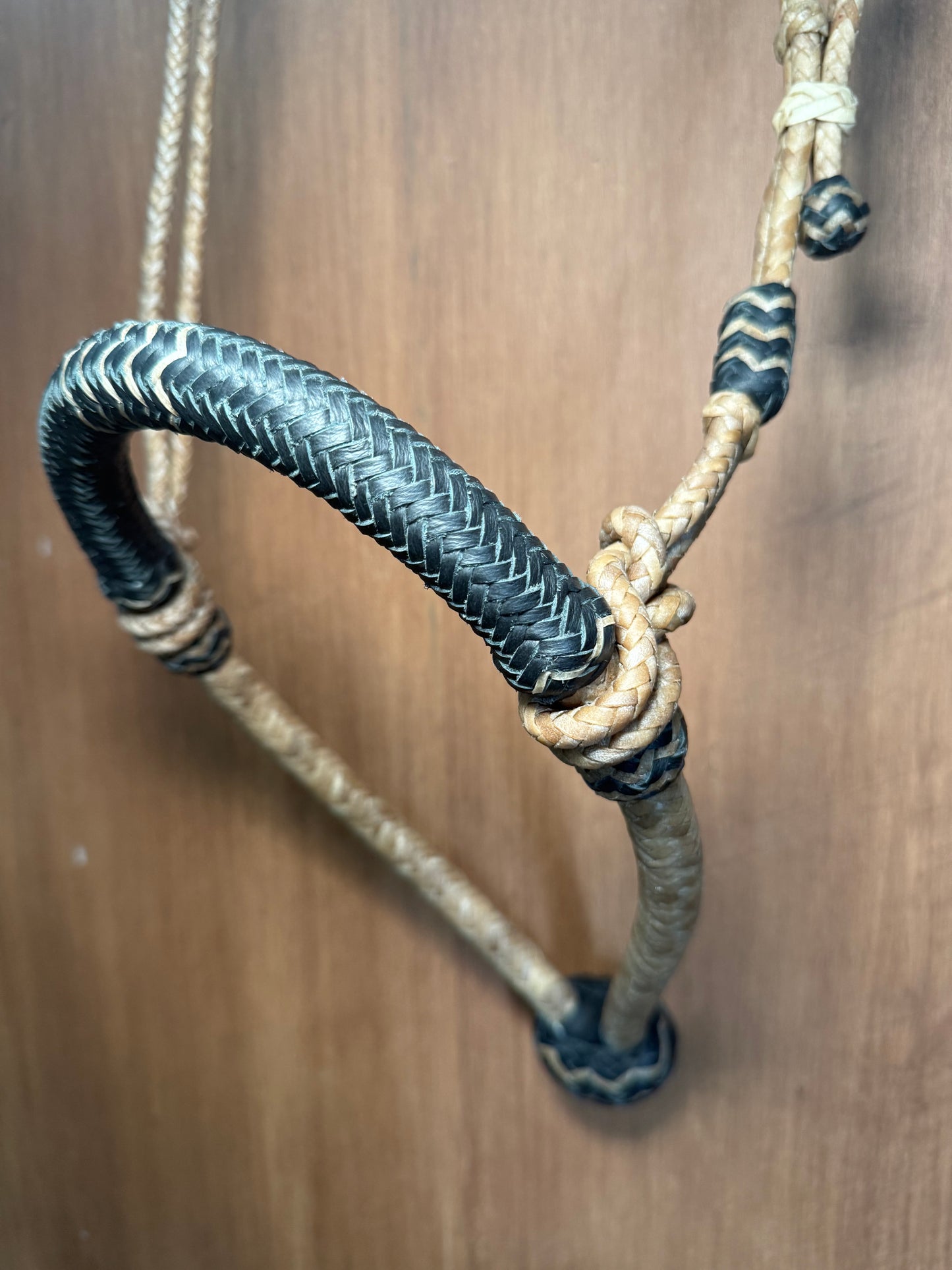Black 5/8” rawhide braided bosal with natural accents & matching rawhide hanger with black knots