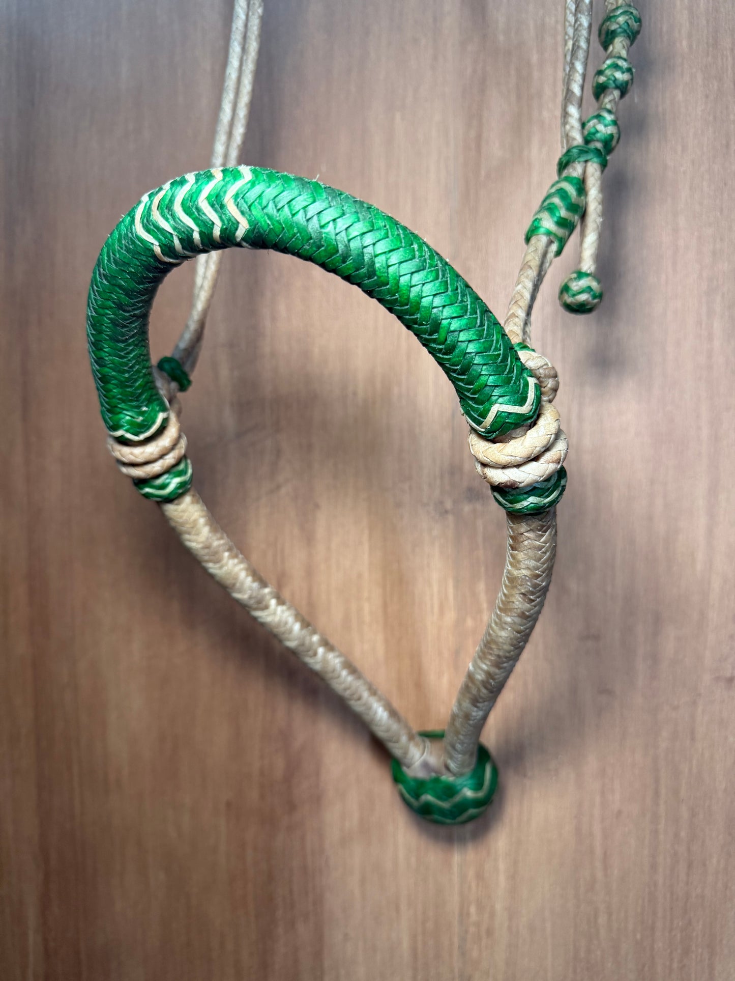 Green 5/8” rawhide braided bosal with natural accents & matching rawhide hanger with black knots