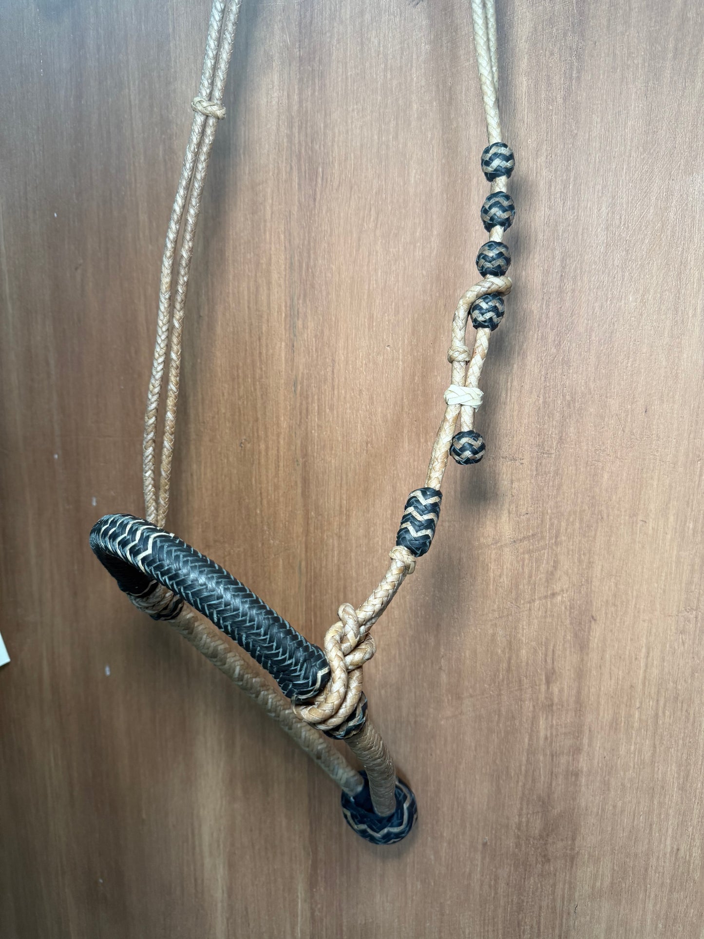 Black 5/8” rawhide braided bosal with natural accents & matching rawhide hanger with black knots