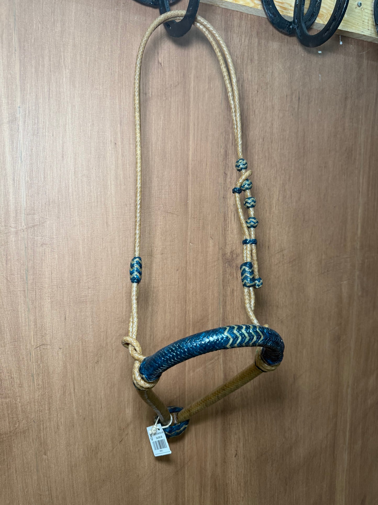 5/8” rawhide braided bosal with natural accents & matching rawhide hanger with black knots