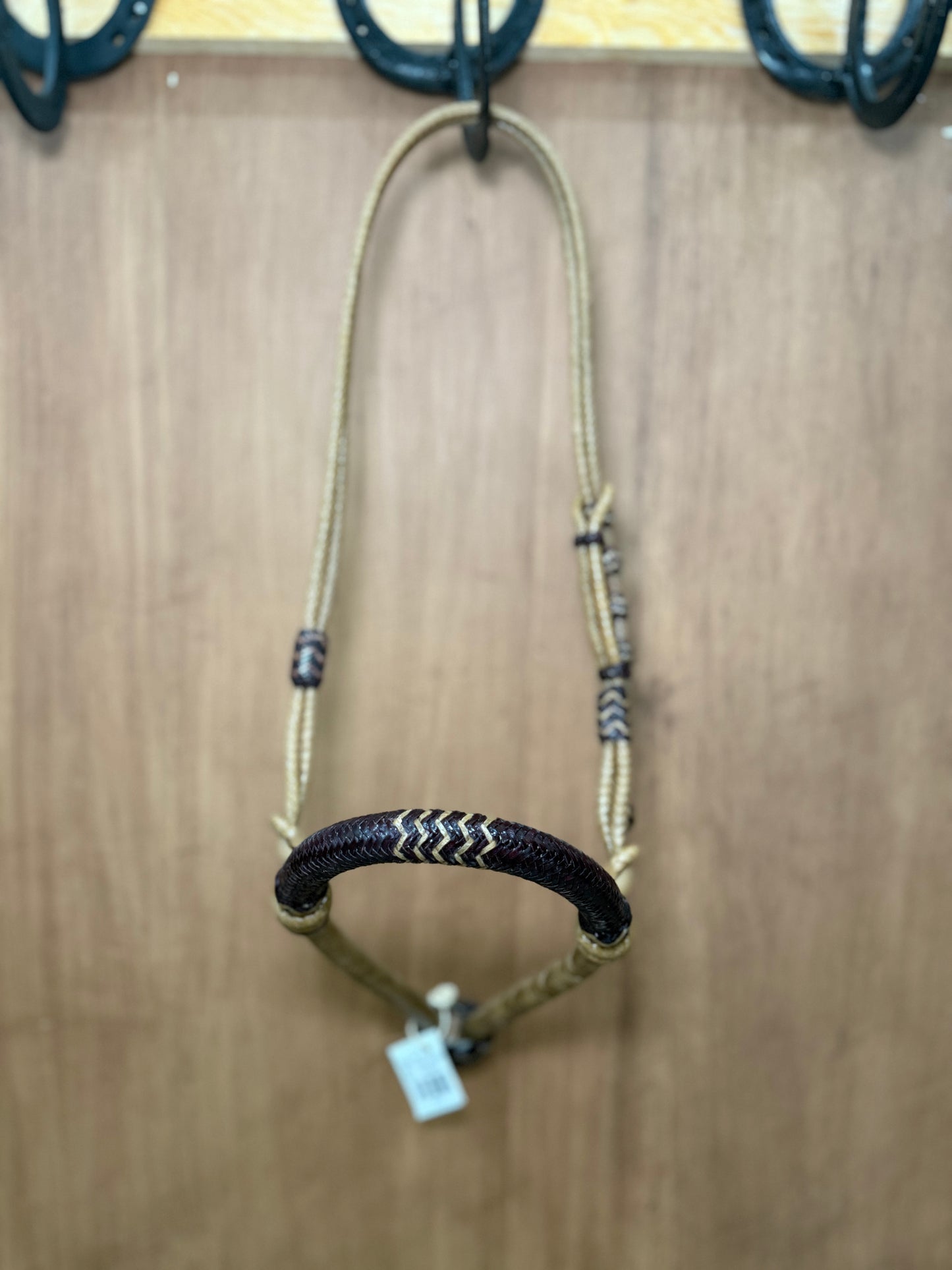 5/8” rawhide braided bosal with natural accents & matching rawhide hanger with black knots