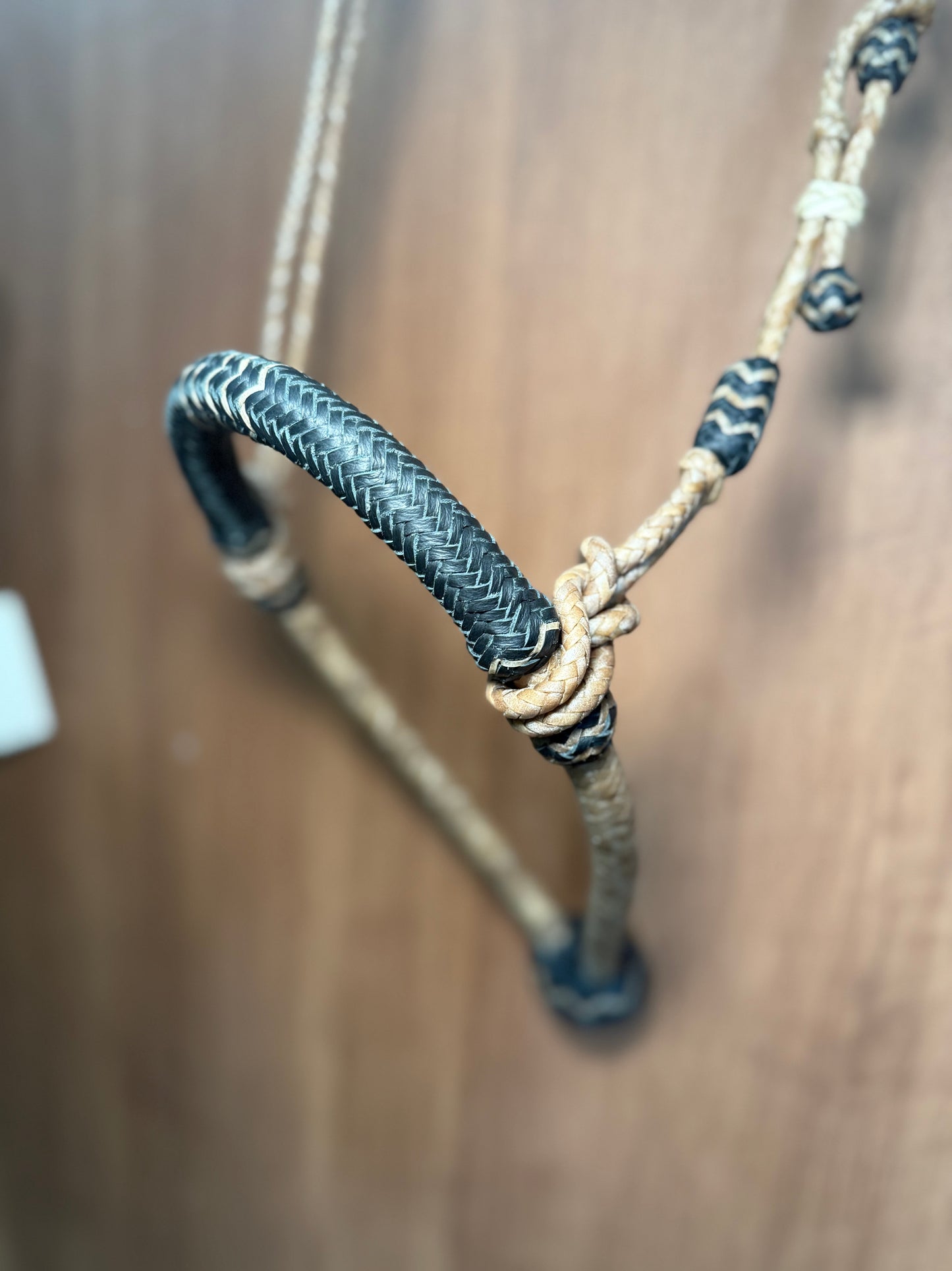 Black 5/8” rawhide braided bosal with natural accents & matching rawhide hanger with black knots