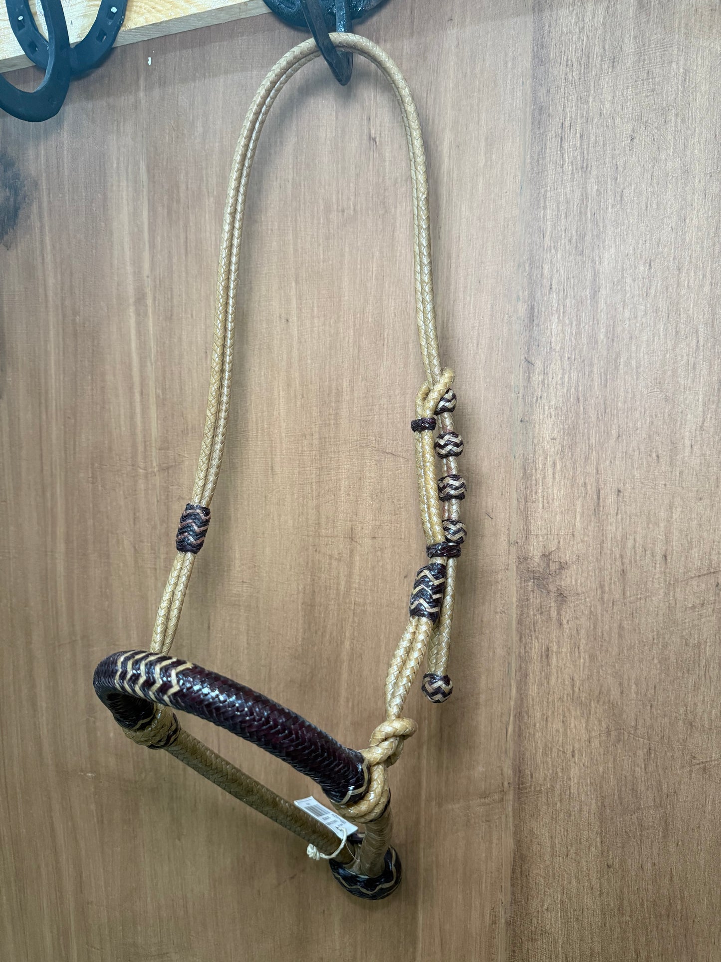 5/8” rawhide braided bosal with natural accents & matching rawhide hanger with black knots
