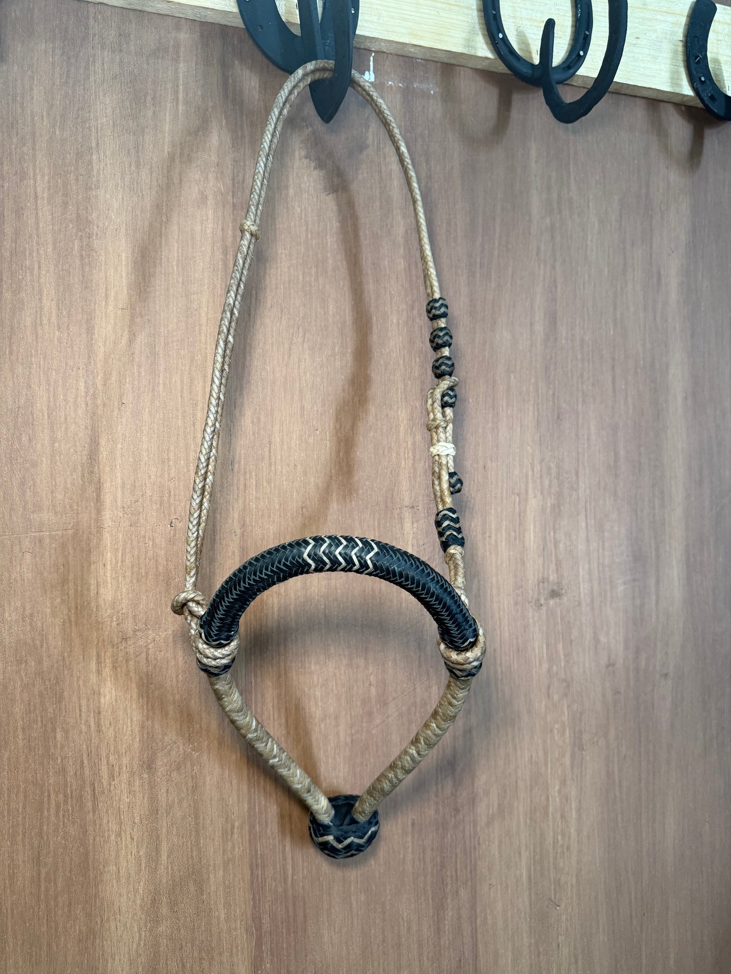 Black 5/8” rawhide braided bosal with natural accents & matching rawhide hanger with black knots