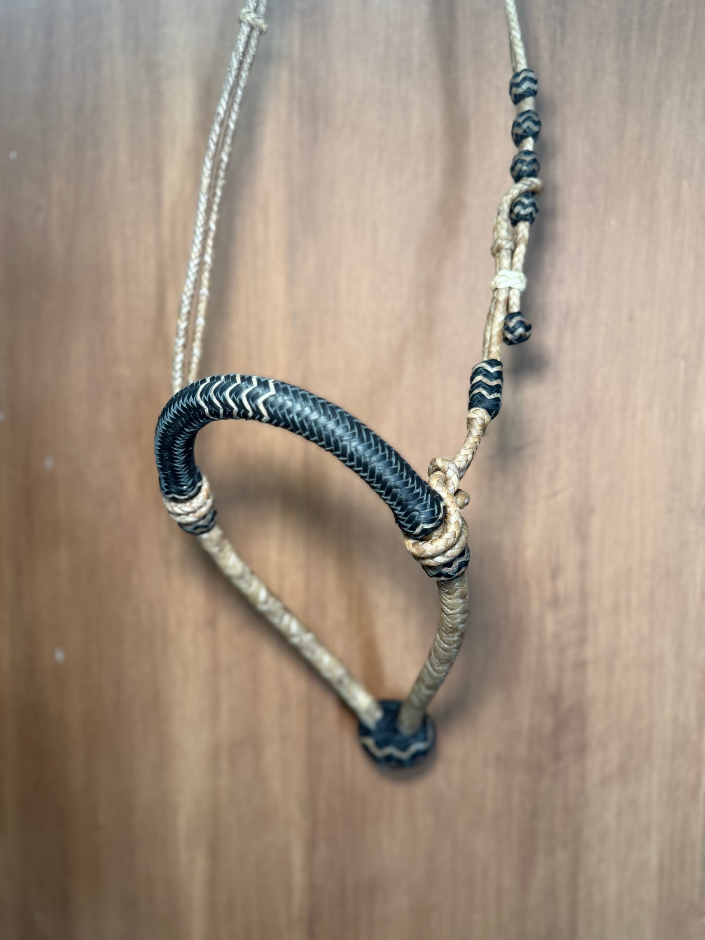 Black 5/8” rawhide braided bosal with natural accents & matching rawhide hanger with black knots