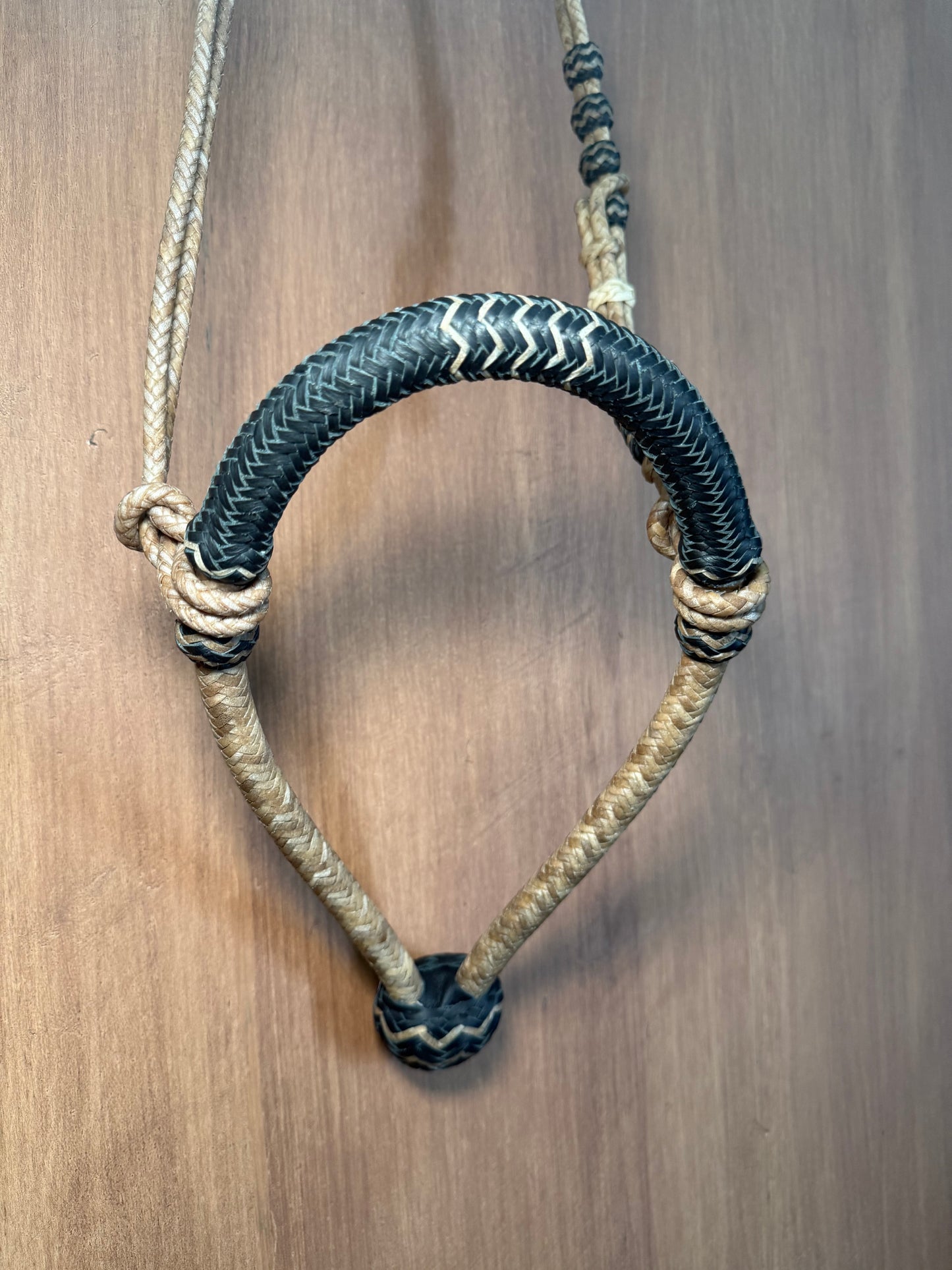 Black 5/8” rawhide braided bosal with natural accents & matching rawhide hanger with black knots