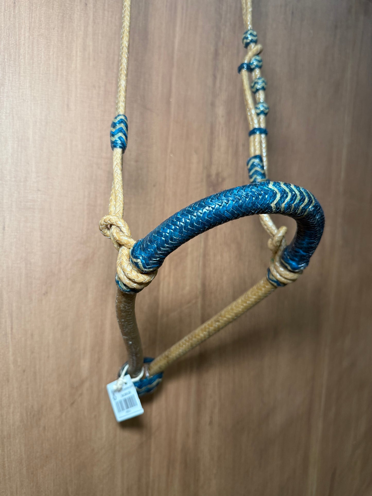 5/8” rawhide braided bosal with natural accents & matching rawhide hanger with black knots