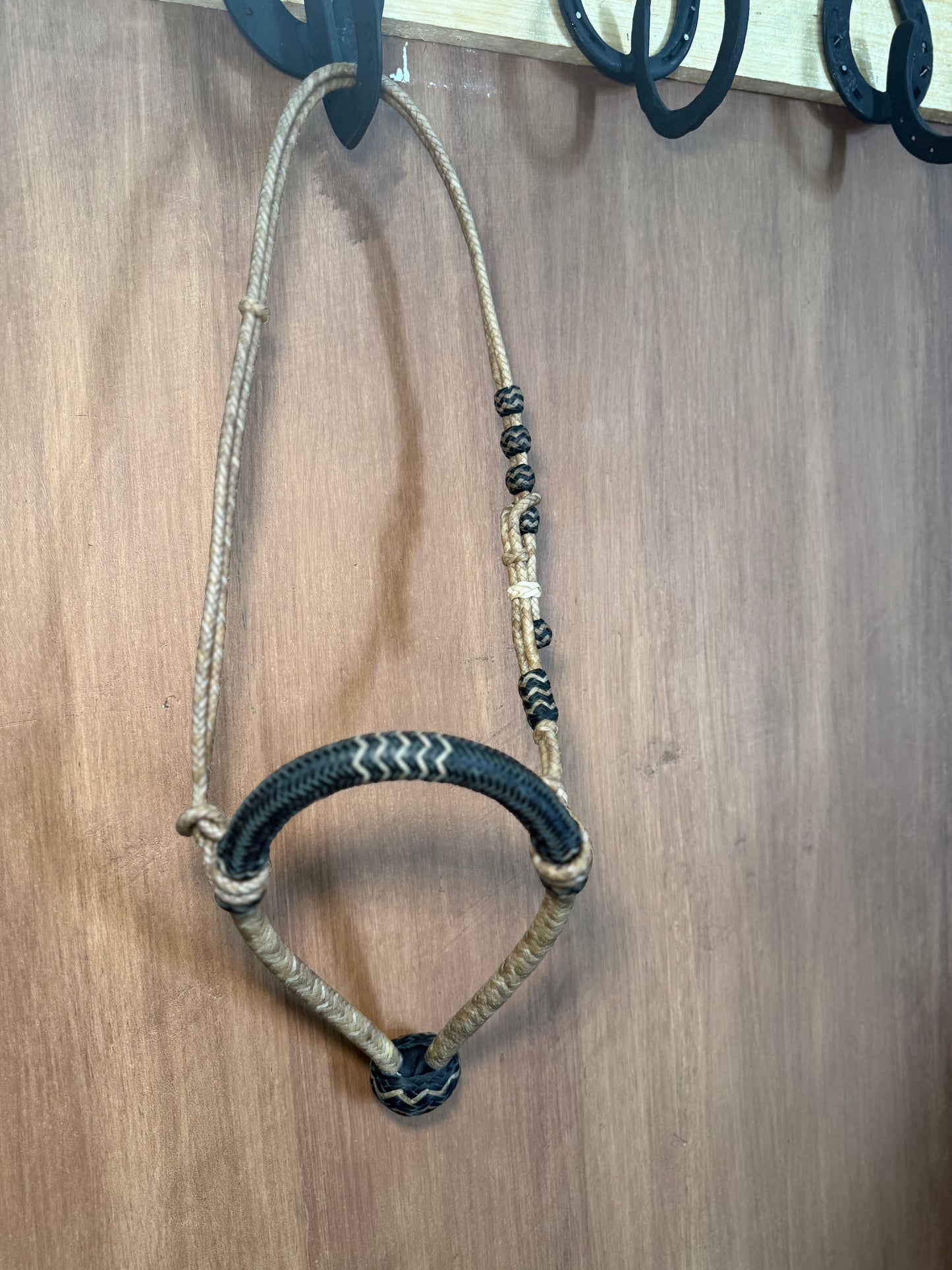 Black 5/8” rawhide braided bosal with natural accents & matching rawhide hanger with black knots